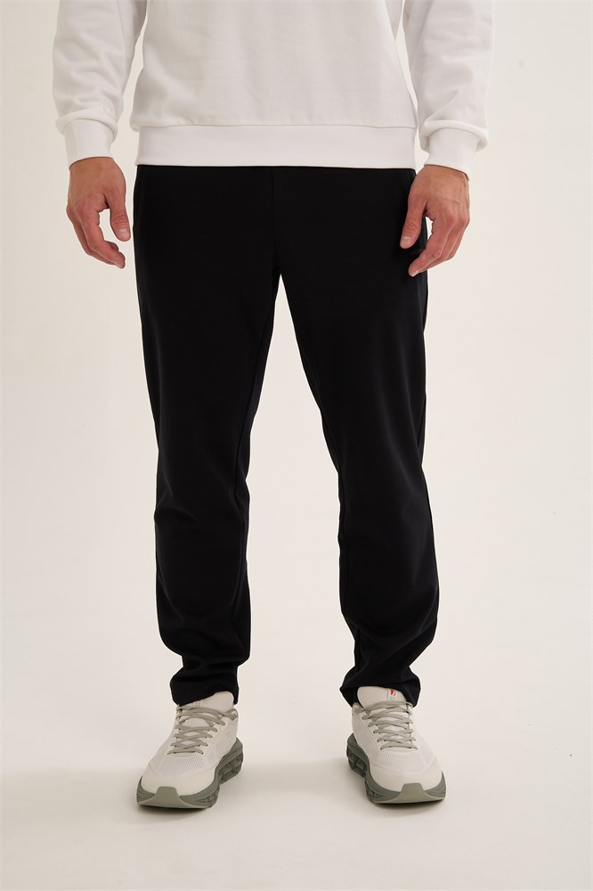 Купить оптом Брюки трикотажные Anta TRN-ESSENTIAL Knit Track Брюки 852637320-1 852637320-1