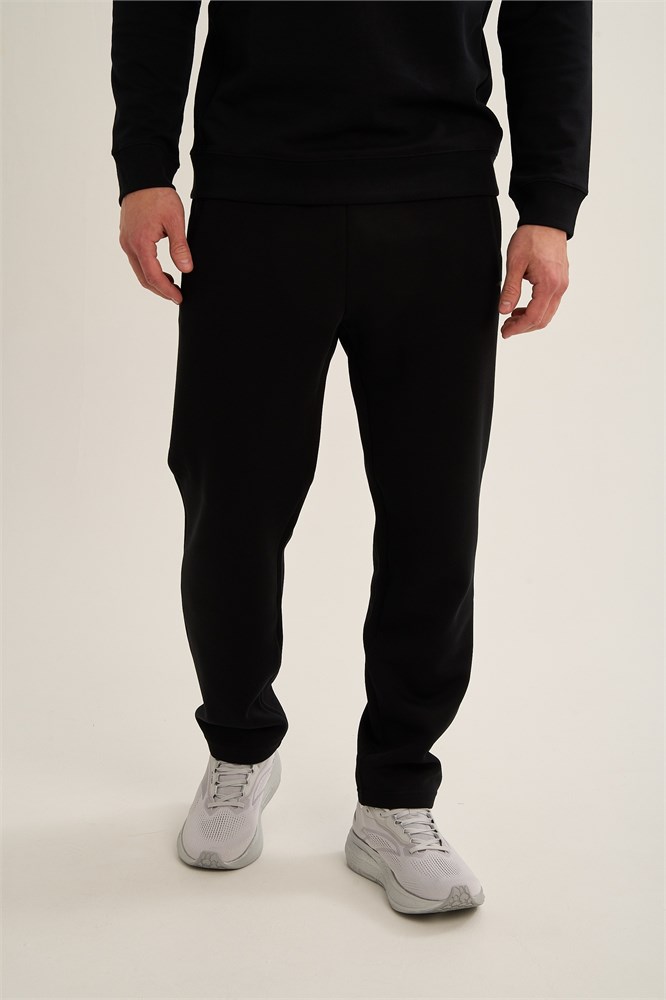 Купить оптом Брюки трикотажные Anta TRN-ESSENTIAL Knit Track Брюки 852647310C-1 852647310C-1