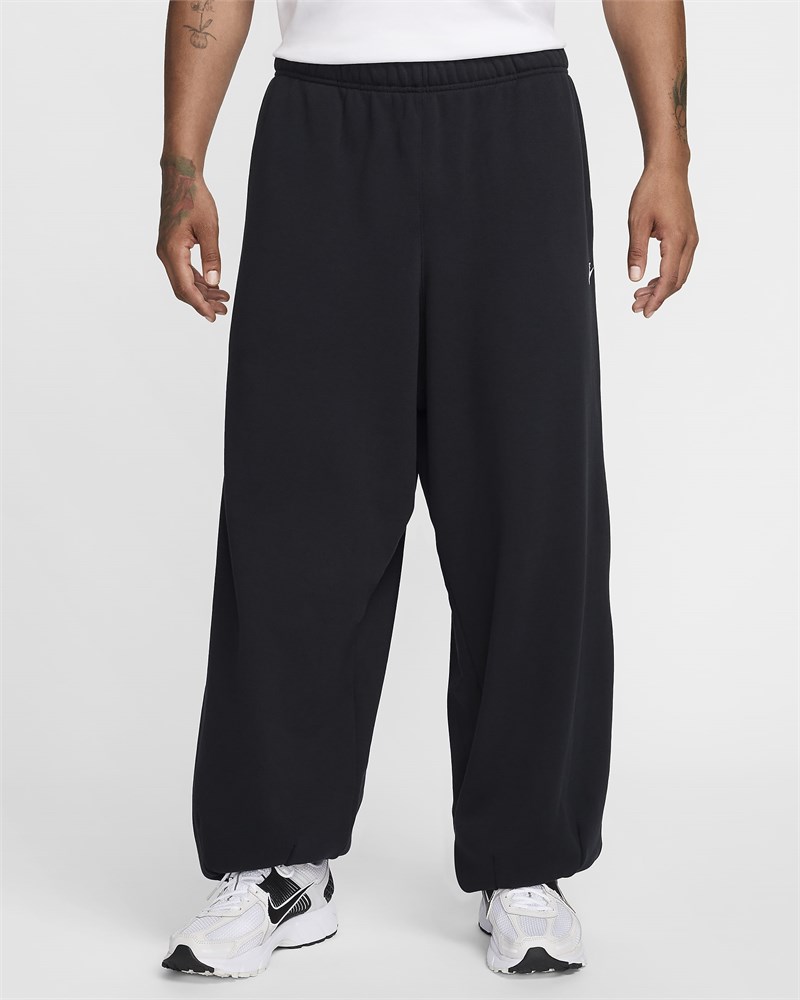 Купить оптом Брюки Nike M NK CLUB FT OVERSIZED PANT HJ1822-010 BLACK/BLACK/WHITE Male HJ1822-010 - фото 91252
