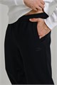 Купить оптом Брюки трикотажные утепленные Anta CAMPUS Knit Track Брюки 852538308D-3 852538308D-3