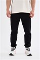 Купить оптом Брюки трикотажные удлиненные Anta TRN ESSENTIAL Knit Track Брюки 852617309SL-1 852617309SL-1