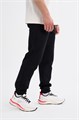 Купить оптом Брюки трикотажные удлиненные Anta TRN ESSENTIAL Knit Track Брюки 852617309SL-1 852617309SL-1