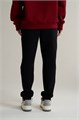 Купить оптом Брюки трикотажные удлиненные Anta TRN ESSENTIAL Knit Track Брюки 862617305SL-1 862617305SL-1