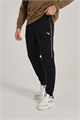 Купить оптом Брюки трикотажные утепленные Anta TRN Knit Track Брюки 852537309D-4 852537309D-4