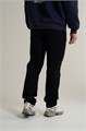 Купить оптом Брюки трикотажные удлиненные Anta TRN ESSENTIAL Knit Track Брюки 852617310SL-1 852617310SL-1