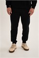 Купить оптом Брюки трикотажные утепленные Anta FLEECE ODP Knit Track Брюки 852631306F-2 852631306F-2