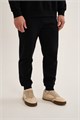 Купить оптом Брюки трикотажные утепленные Anta FLEECE ODP Knit Track Брюки 852631306F-2 852631306F-2