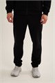 Купить оптом Брюки трикотажные удлиненные Anta TRN-ESSENTIAL Knit Track Брюки 852647310LC-1 852647310LC-1