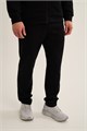 Купить оптом Брюки трикотажные удлиненные Anta TRN-ESSENTIAL Knit Track Брюки 852647310LC-1 852647310LC-1