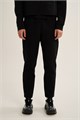 Купить оптом Брюки трикотажные удлиненные Anta TRN-ESSENTIAL Knit Track Брюки 862647302LC-1 862647302LC-1