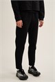 Купить оптом Брюки трикотажные удлиненные Anta TRN-ESSENTIAL Knit Track Брюки 862647302LC-1 862647302LC-1