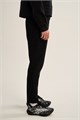 Купить оптом Брюки трикотажные удлиненные Anta TRN-ESSENTIAL Knit Track Брюки 862647302LC-1 862647302LC-1