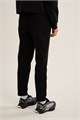 Купить оптом Брюки трикотажные удлиненные Anta TRN-ESSENTIAL Knit Track Брюки 862647302LC-1 862647302LC-1