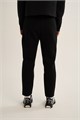 Купить оптом Брюки трикотажные удлиненные Anta TRN-ESSENTIAL Knit Track Брюки 862647302LC-1 862647302LC-1